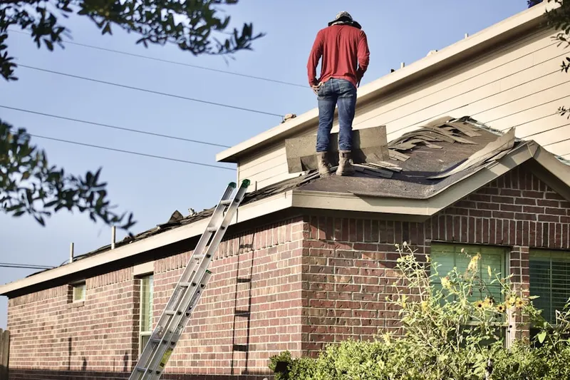 Professional roofer working on a residential roof in Eucalyptus Hills